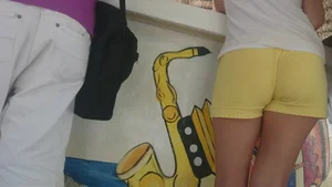 Milf in yellow shorts with vpl and a wedgie