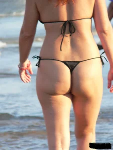 Bunch of sexy babes at the beach in thong bikinis