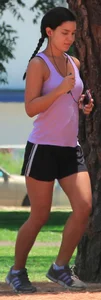 Hot brunette running in short shorts with vpl