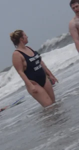 Thick blonde on the beach with a big booty in a blue swimsuit