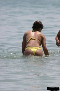 Beach voyeur girls in bikinis, thongs and topless