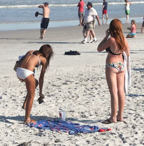 Two cute teens in bikinis
