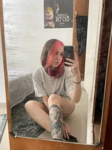 Cute tattooed girl mirror selfies in various clothes