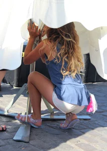 Sexy blonde girl in short white shorts