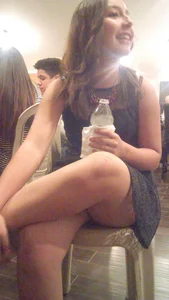 Cute College Girl Sitting Cross-Legged on the Chair