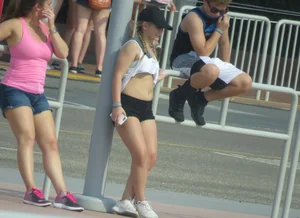 Couple of babes standing around in shorts
