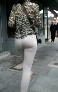 Brunette lady with a nice ass in light grey leggings walking