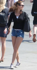 Cute girl with nice legs in short denim shorts