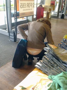 Candid whale tail in a shop