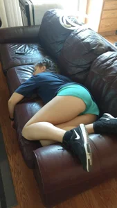 Girl in Mini Shorts Asleep in the Couch