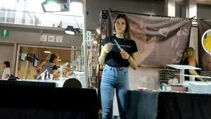 Jewelry vendor in light blue jeans