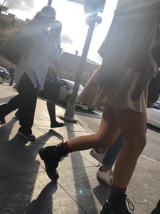 Nice legs, candid girl wearing a skirt and boots
