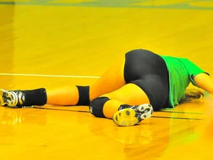 Female Volleyball Player Lying on the Gymnasium Floor in a Weird Pose - Hot Ass Though