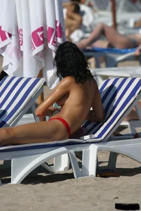Beach voyeur girls in bikinis, thongs and topless
