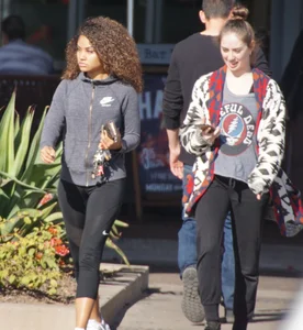 Beautiful black girl in Nike leggings in the parking lot