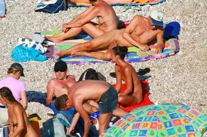 Ula FKK Sexy brunette on a nude beach topless, bottomless and with blue thong
