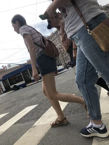 Young Girl in Shorts And Sandals Crossing the Street Gallery