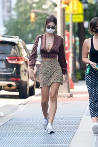 Emily Ratajkowski in mini skirt out for a walk with a friend in New York