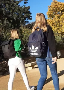 Two beautiful teens in jeans. One white and one blue jeans