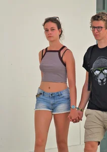 Beautiful teen out with boyfriend in short jean shorts
