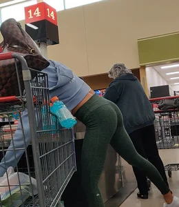 Insanely hot brunette shopping in tight green leggings