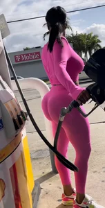 MUST SEE juicy black booty pumping gas