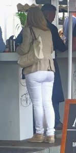 Milf's ass in shiny white tight pants street creep