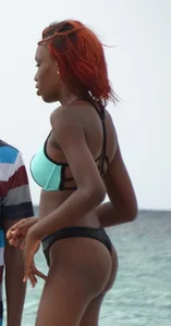 Candid black family, milf and teens on the beach in bikinis