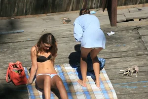 Two teens stripping and going topless to tan
