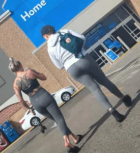 Tight ass in spandex with back Tattoo