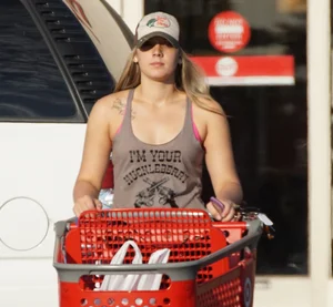 Hot blonde after shopping in short jean shorts and tank top