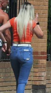 Blonde in skintight jeans shopping with boyfriend