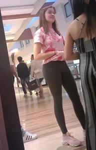 Smiling young girl in leggings mall photo