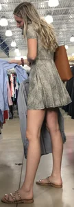 Basic blonde in a dress shopping for her man
