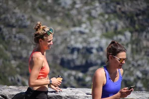 Tourist friends backpacking in shorts with vpl
