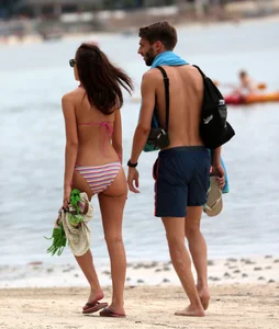 Curvy wide hipped and big bootied brunette on the beach