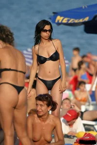 Beach voyeur girls in bikinis, thongs and topless
