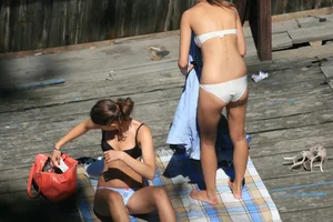 Two teens stripping and going topless to tan