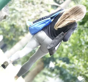 Tight bum walking through the park