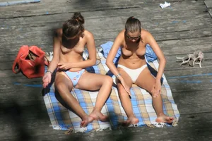 Two teens stripping and going topless to tan