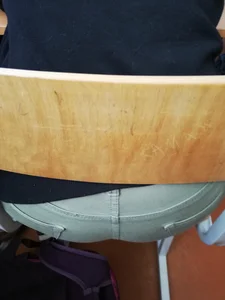 Booty closeup of a candid college girl sitting at her desk in class