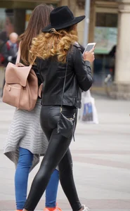 Skinny pretty babe in shiny pants with vpl