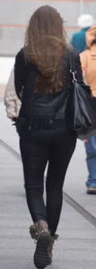 Pretty girl walking in tight black pants
