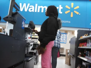 Ebony girl with a cute booty and vpl in pink sweats at Walmart
