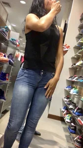 Hot Tall Girl in Blue Tight Jeans Touching Her Hip Store Creepshot
