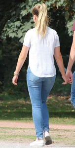 Blonde chick walking with her boyfriend in tight jeans