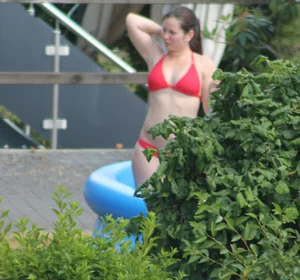 Thick babe in the backyard in red bikini