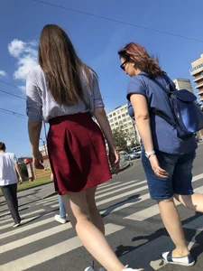 Girl in a Skirt with Sexy Skinny Legs on the Crosswalk Candid Photos