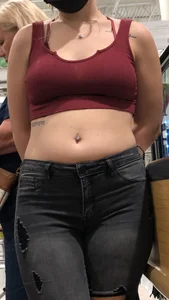 Latina in Maroon crop top and tight black jeans