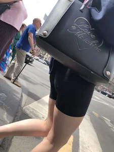 Great legs and booty in spandex shorts of a street candid girl crossing the street